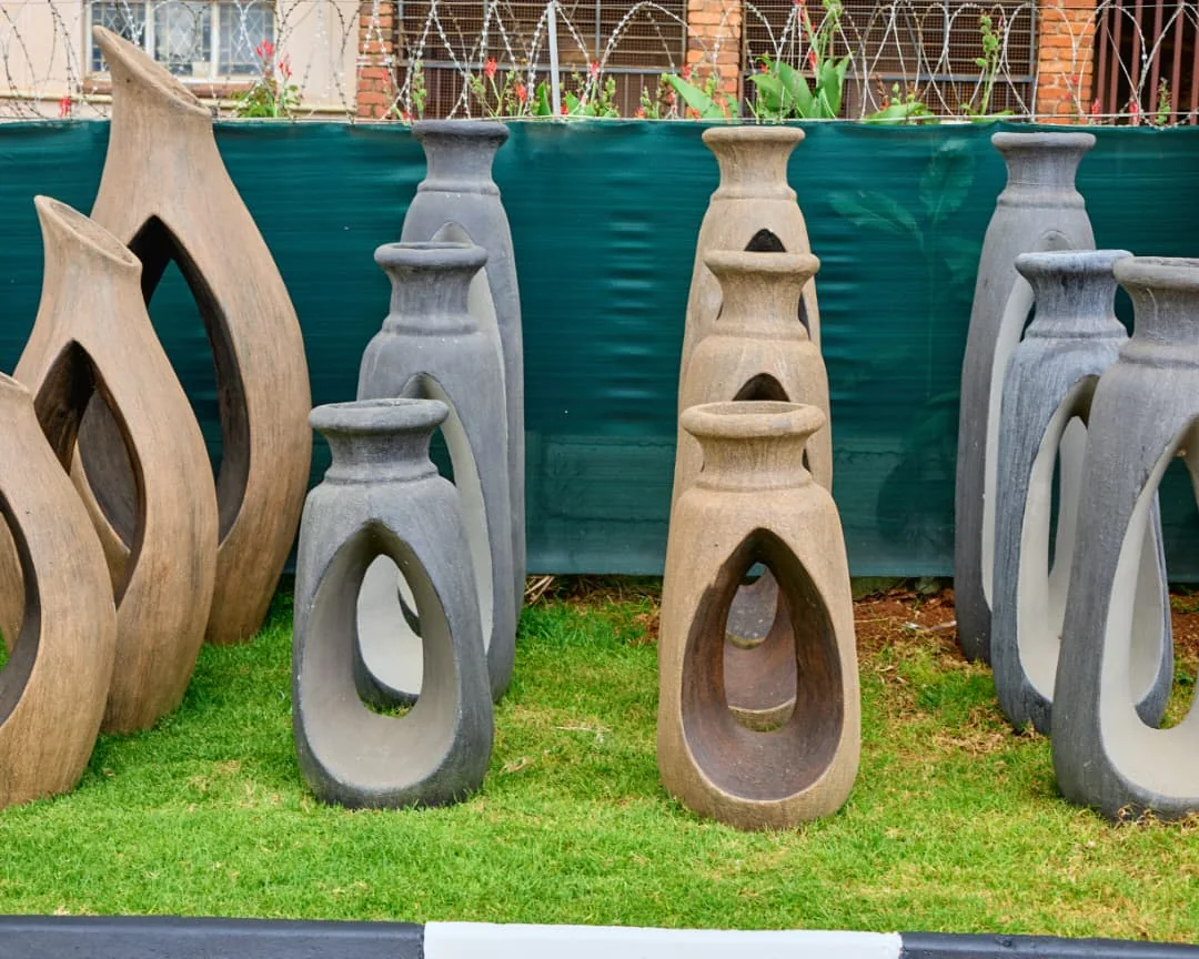 Sculptural garden pieces in natural finishes