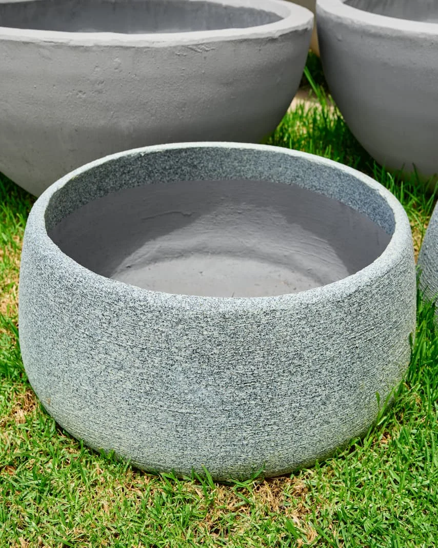 Round sculptural concrete planters